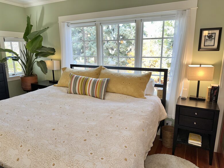 The main bedroom: great cross-ventilation + overhead fans