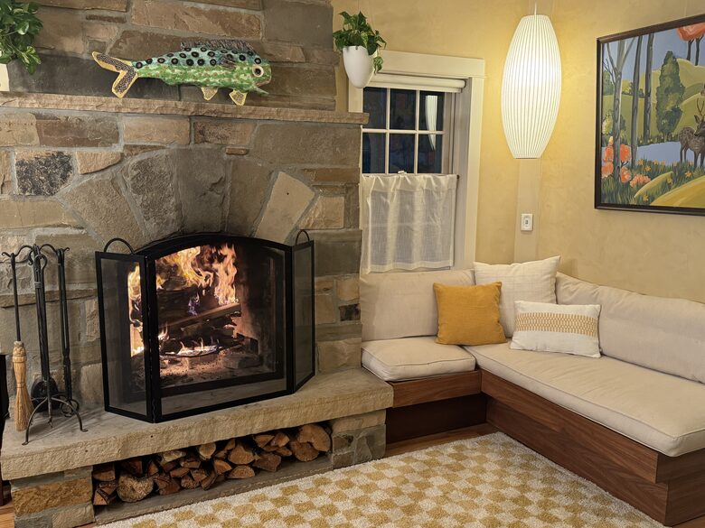 The family/TV room with a roaring fire