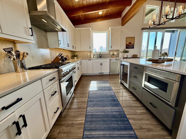 Kitchen with Island Microwave and Wine Fridge