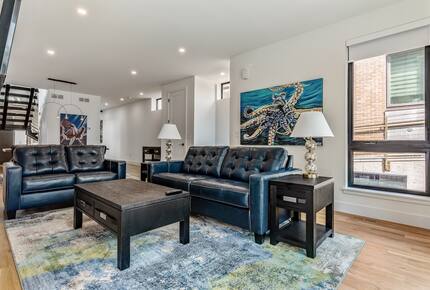 Main floor living room with fold out queen bed