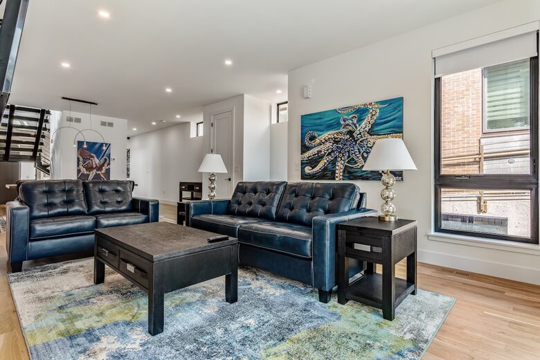 Main floor living room with fold out queen bed