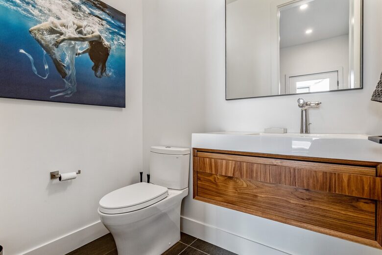 Main floor half bathroom off of mud room