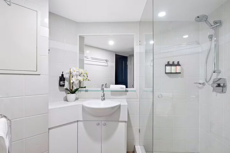 Bathroom ensuite with plush towels and organics
