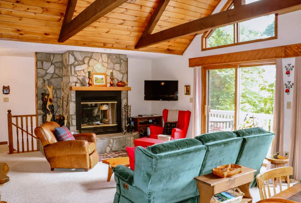 Family room with high ceilings and beams