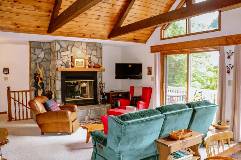 Family room with high ceilings and beams