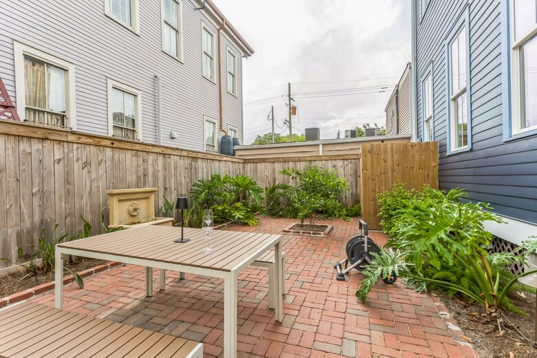 Private Backyard with Custom Lighting and Fountain