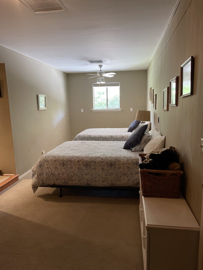 Back bedroom w/ two queen sized beds