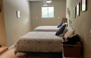 Back bedroom w/ two queen sized beds
