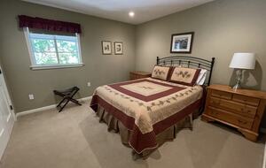 Hall bedroom with queen sized bed