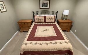 Hall bedroom with queen sized bed