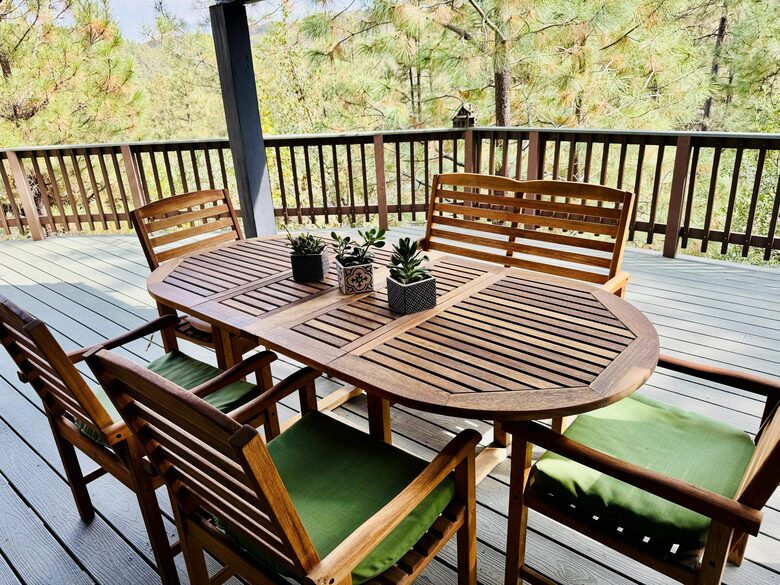 Outdoor dining area with forest views