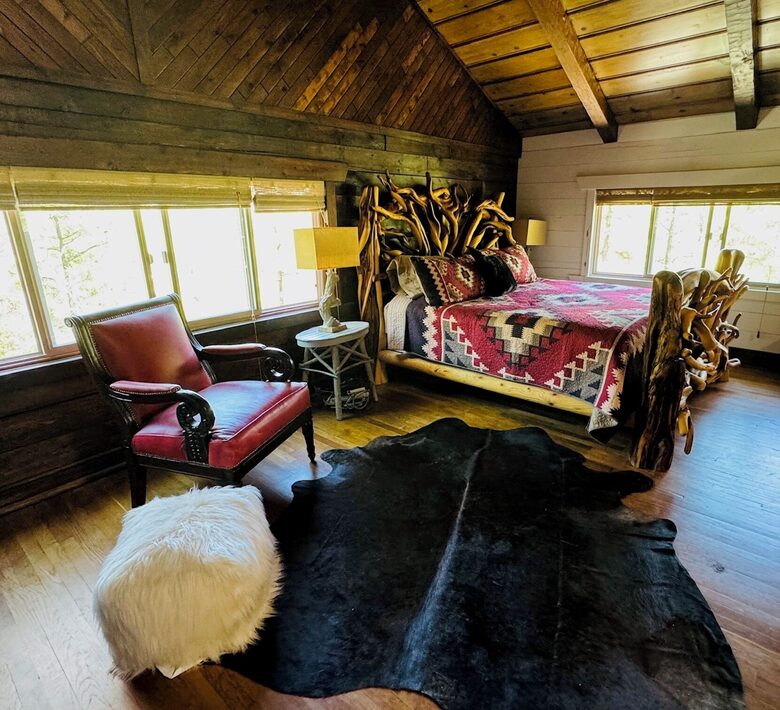 Primary bedroom on top level; custom artisan-made bed