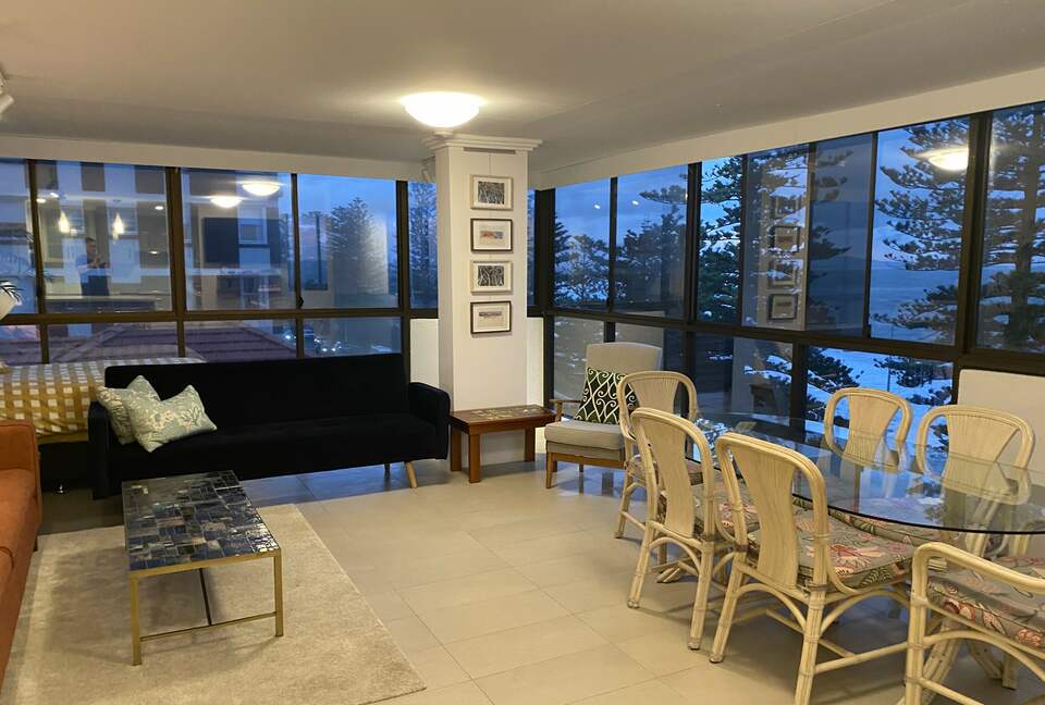 Huge dining area with 6 chair dining setting, two sofas and day bed