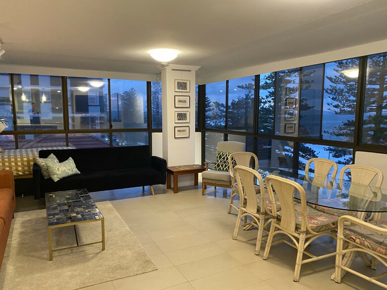 Huge dining area with 6 chair dining setting, two sofas and day bed