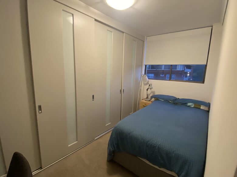 Third bedroom has a single bed , an office desk and huge wardrobes