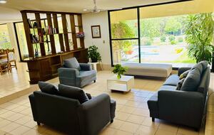 Living room with Pool views