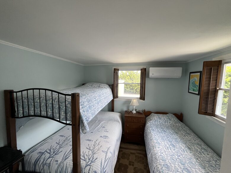 Bunk room with 2 twins and one full bed