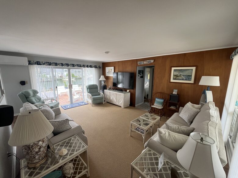 Living room with 65” TV and surround sound music system