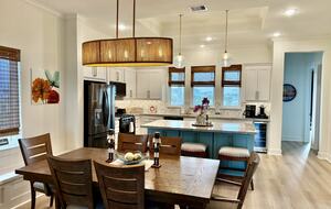 Admire the back patio and sunset lagoon from kitchen windows