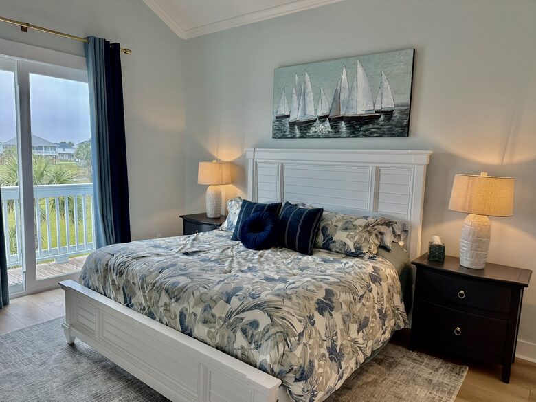 Comfortable master with access to back patio and view