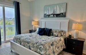 Comfortable master with access to back patio and view