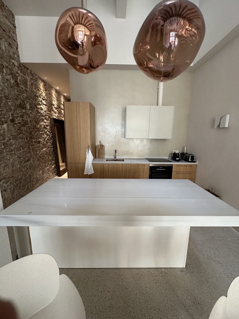 Fully equipped kitchen with marble countertops and island