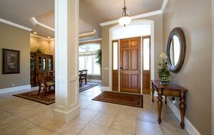 Foyer front entrance with Dining table in background