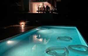 pool at night with lights on