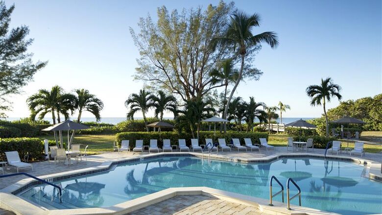 Una tranquila escapada a una isla frente al mar con servicios de complejo turístico - Isla de Sanibel, Florida