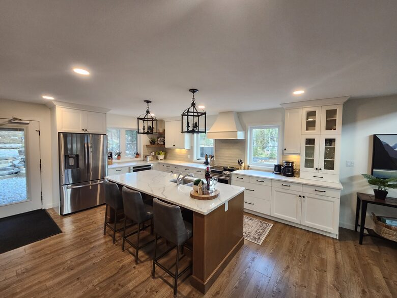 Kitchen and door to backyard, hot tub, fire pit, forest.