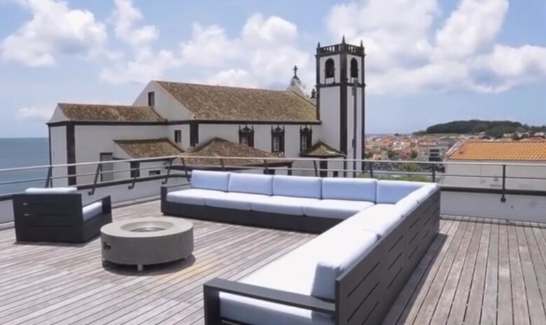 Rooftop Deck with Seating Area and Views of Ocean and Historic Church