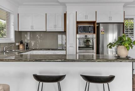 Open kitchen connected to dining space