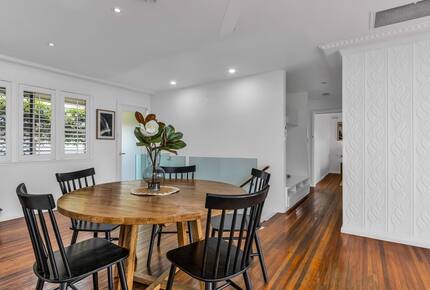Bright dining area centered around the table