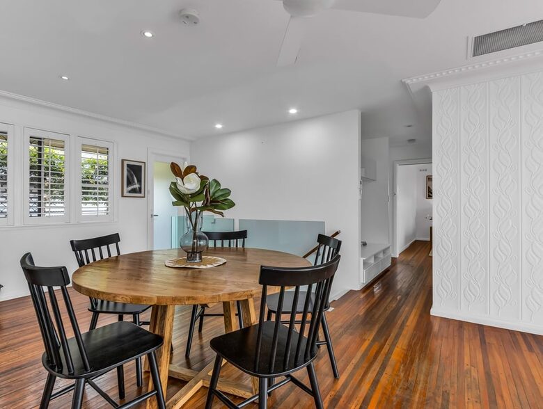 Bright dining area centered around the table