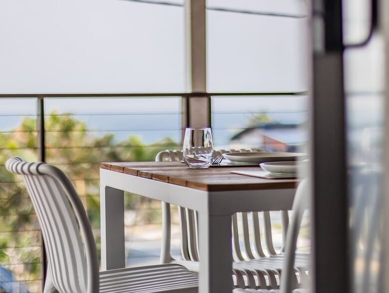 Balcony dining with open air and sunlight