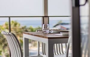 Balcony dining with open air and sunlight