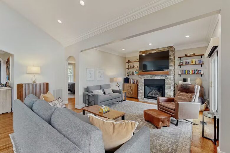Den with radiant heat fireplace