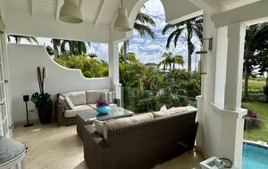 Outdoor living area with sunset views over the Caribbean Sea