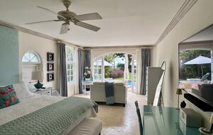 Main bedroom with living area and pool access
